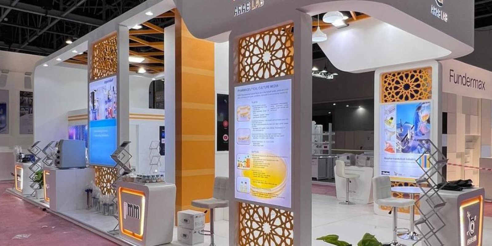 Arab Lab exhibition stand side view by Story Design with lattice panels and lightboxes