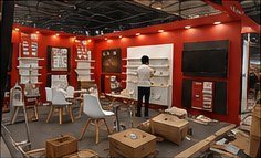 Golstar stall nearing completion at LED Expo Mumbai, with furniture being placed